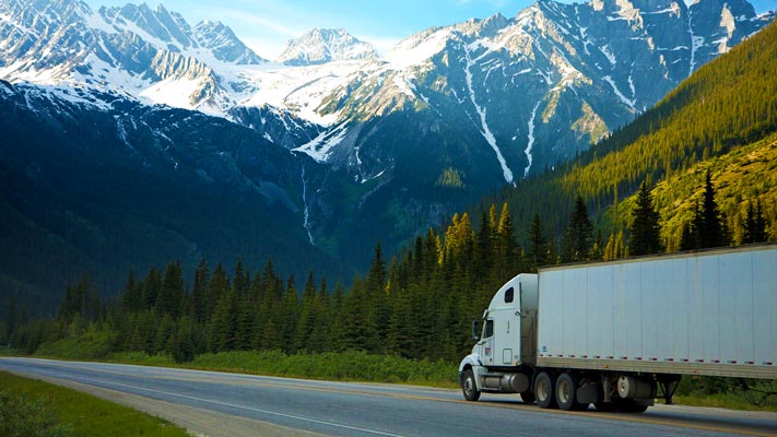 Wood transportation on flat bed semi trailer